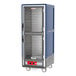 A blue Metro C5 heated holding cabinet with shelves and clear Dutch doors.