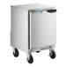 A silver Beverage-Air undercounter refrigerator with black wheels.