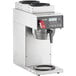 An Estella Caffe commercial coffee maker with a digital display and 3 stainless steel decanter warmers.