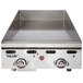 A Vulcan commercial gas griddle with a chrome top on a counter.