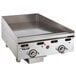 A Vulcan stainless steel commercial griddle with chrome top and knobs.