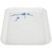 A white tray with blue bamboo design on it.