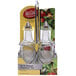 A Tablecraft European Collection clear glass oil and vinegar cruet set on a chrome rack.