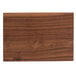 A John Boos black walnut wood cutting board with the word "pears" carved on it.