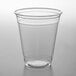 A 12 oz. clear plastic cup on a white surface.