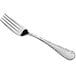 An Acopa stainless steel dinner fork with a silver handle.