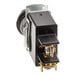 A black metal toggle switch with a gold knob.