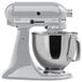 A metallic chrome KitchenAid mixer with a bowl on top.