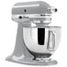 A KitchenAid Artisan Series 5-quart stand mixer in metallic chrome with a bowl.