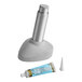 A Kason 9000 toilet jack on a counter next to a tube of silicone glue.
