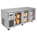 A Turbo Air undercounter refrigerator with glass doors open and fruit inside.