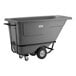 A gray heavy-duty tilt truck or trash cart with a 0.5 cubic yard capacity and sturdy wheels, designed for transporting large loads.