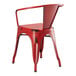 A red Lancaster Table & Seating metal arm chair with a backrest.