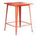 A Lancaster Table & Seating bar height outdoor table with a square orange top and legs.