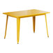 A Lancaster Table & Seating citrine yellow table with metal legs.