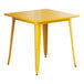 A Lancaster Table & Seating citrine yellow table with metal legs and a square top.