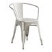 A Lancaster Table & Seating silver metal arm chair.