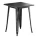 A Lancaster Table & Seating black metal table with legs.