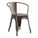 A brown Lancaster Table & Seating outdoor arm chair with arms and back.