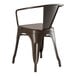 A brown metal Lancaster Table & Seating outdoor arm chair with a backrest and arms.