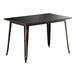 A black Lancaster Table & Seating Alloy Series table with distressed copper legs.