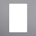 A white rectangular label with a black border on a gray surface.