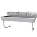 a stainless steel sink with faucets