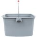 A Rubbermaid gray bucket with a red handle and divider.