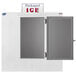 A Leer outdoor ice merchandiser with a galvanized steel door open to packed ice.