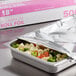 A tray of broccoli and cauliflower in aluminum foil.