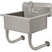 A stainless steel Advance Tabco multi-station wall mounted utility sink with a faucet.