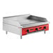 An Avantco countertop gas griddle with red and black accents.