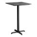 A square bar height table with a black smooth finish top and a black cross base plate.