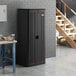 A Suncast dark gray heavy-duty tall storage cabinet.