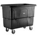 A black plastic cube truck with wheels.
