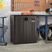 A dark gray Suncast heavy-duty storage cabinet with tools.