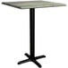 A Lancaster Table & Seating square counter height table with a textured black metal base.