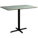 A Lancaster Table & Seating rectangular counter height table with a textured black metal base.