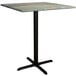 A Lancaster Table & Seating square bar height table with a metal base and a textured canyon top.