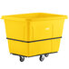A yellow plastic Lavex cube truck with wheels.