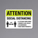 A black and yellow reflective sign with the words "Attention" and "Social Distancing" and a symbol.