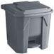 A Lavex gray plastic rectangular step-on trash can with a lid.