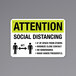 A black and yellow aluminum sign that says "Attention / Social Distancing" with a symbol of people standing 6 feet apart.