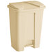A beige plastic Lavex step-on trash can with a lid.