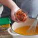 a person holding a bowl of food