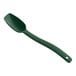 A Carlisle forest green plastic spoon with a long handle.
