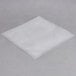 A white square plastic bag on a gray surface.