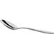 An Acopa Remy stainless steel tablespoon with a long silver handle.