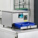 A stainless steel Bar Maid CP-3000 cutlery dryer and polisher machine with a blue tray for utensils.