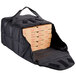 A black Vesture NextPhase insulated delivery bag holding several pizza boxes.